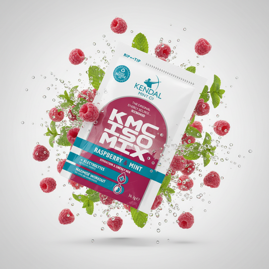 Kendal Mint Co KMC ISO MIX raspberry mint packet surrounded by raspberries and mint leaves on a light gray background.